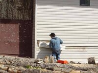 larry fixing siding.JPG