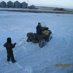 the boys trying to ride the wheeler, follwoing in my foot steps hahah getting stuck right infront of the house!!!