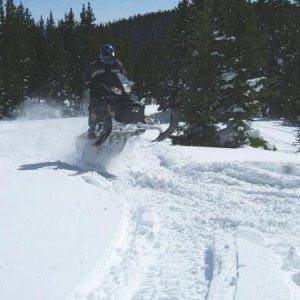 DJ jumping an 08 Ski Doo MXZ Renegade.