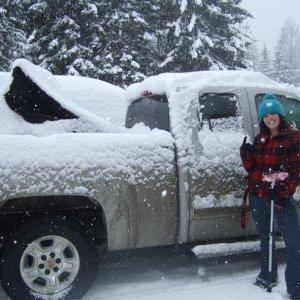 Outside of Big Eddy's in Revy brushing off the snow from my truck!  Look how much fell while I was just having breaky!  :)