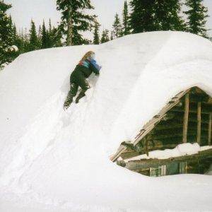 going up onto Wolverine Cabin to clean away snow from the stove pipe