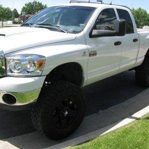 my truck, 07' dodge 5.9 Liter cummins, 6 inch lift, 37 toyo tires with rockstar rims, smoke stack, chip, intake, airbags hide away hitch, tv, and lots