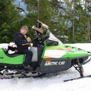 Colton at 7 years old riding his own sled up Turtle Mtn in Revy.