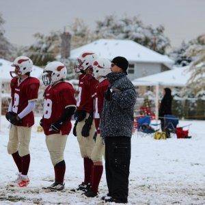 Captains with coach!  Fun playoff game in the snow.  40-0 win over West