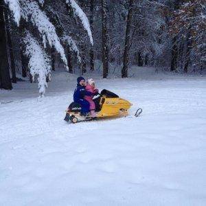 son and daughter riding the mini-z