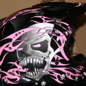 Pink and bad a$$ skulls. My kinda helmet! :)