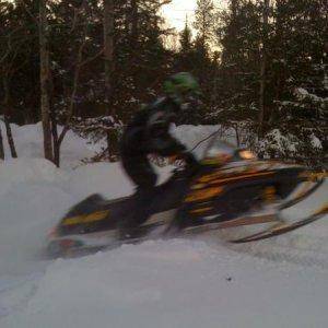 My cousin hitting a snowbank, he was just messing around, the other pic of him is when he flew.