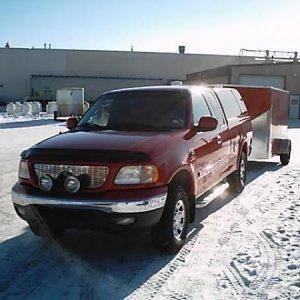 This gives you a good idea how well the trailer tows  :)    It is low profile in both height and width, fits close to the truck and really does tow ni