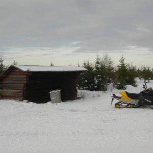 My sled up near a shelter. Took this before we went riding, I was on my way to the lake to meet the group and had to pee.