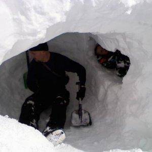 Me and my son in the snowcave we built