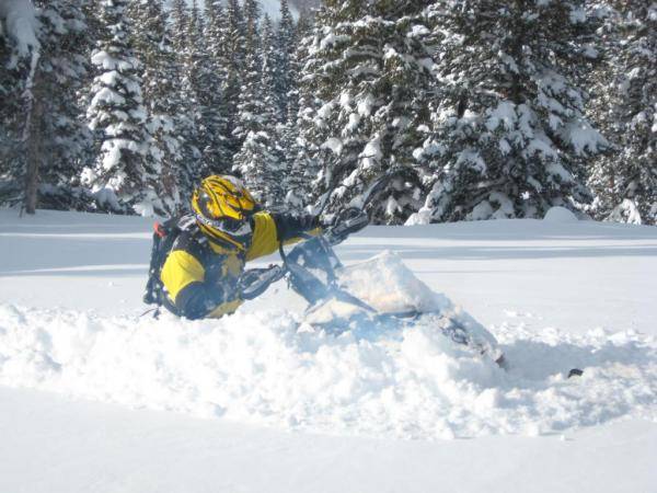 Andris, after a beautiful carve in the powder. Deep stuff!
Janette taking the pic