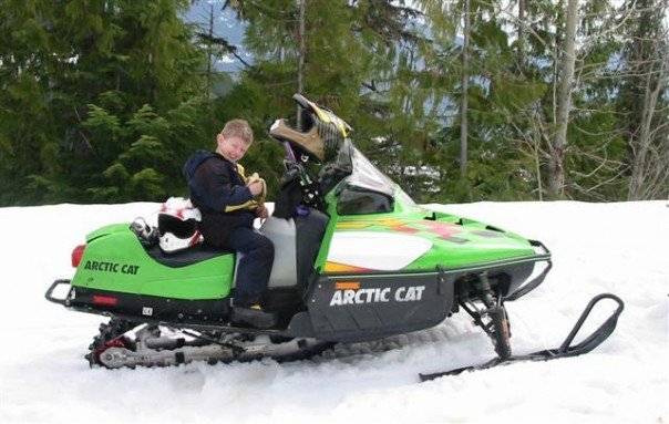 Colton at 7 years old riding his own sled up Turtle Mtn in Revy.