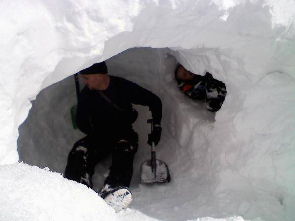 Me and my son in the snowcave we built