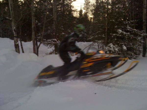 My cousin hitting a snowbank, he was just messing around, the other pic of him is when he flew.