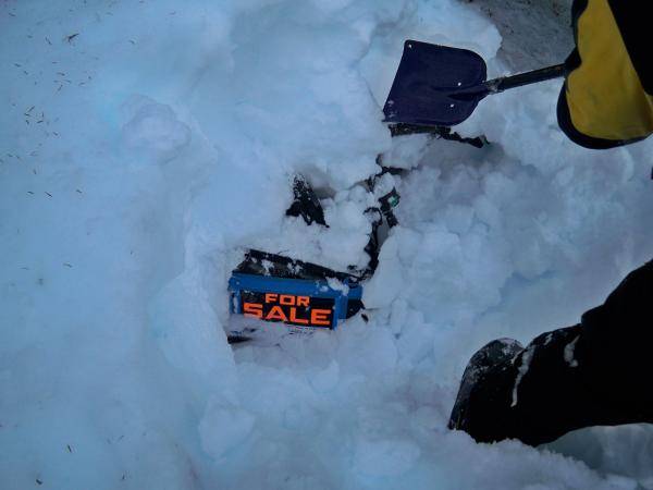 My friend digging out his machine covered in 2ft of snow. (still has the for sale on it lol.)