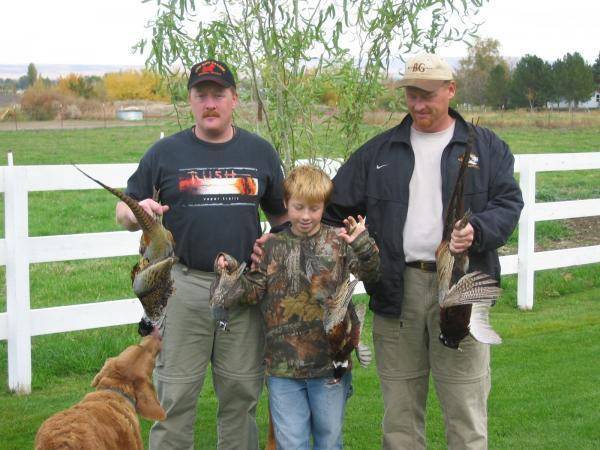 My nephews 1st Rooster Pheasant!! With my bro!!I'm on the left!