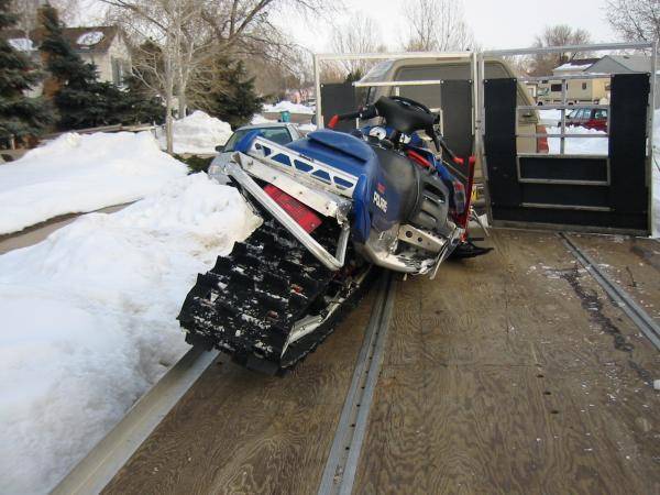 Nate's Sled bashed up at my house on the trailer.