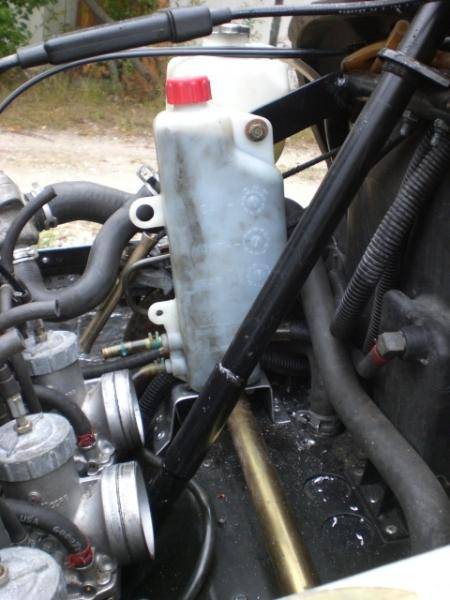 oil tank mount. I cut the old oil/coolant tank mount off and welded on a new tab for the new small oil tank(xlt coolant bottle)