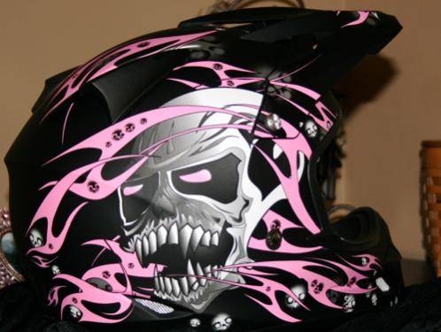 Pink and bad a$$ skulls. My kinda helmet! :)