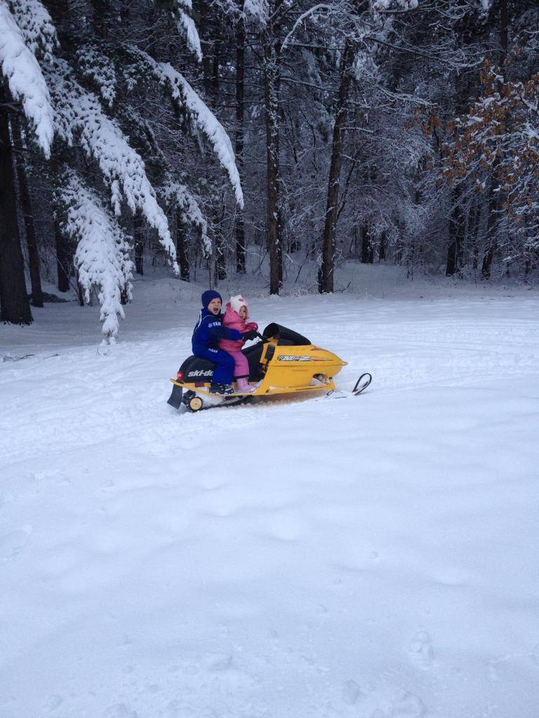 son and daughter riding the mini-z