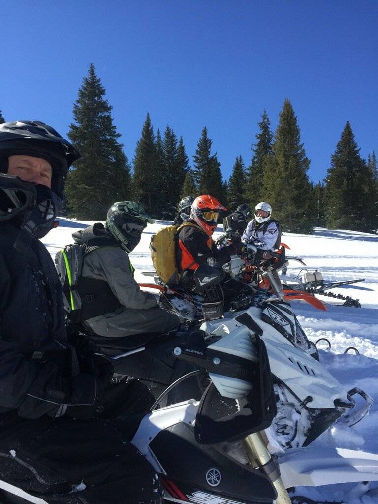 the lone sled with the snowbike gang