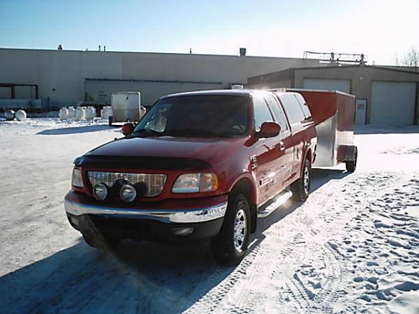 This gives you a good idea how well the trailer tows  :)    It is low profile in both height and width, fits close to the truck and really does tow ni